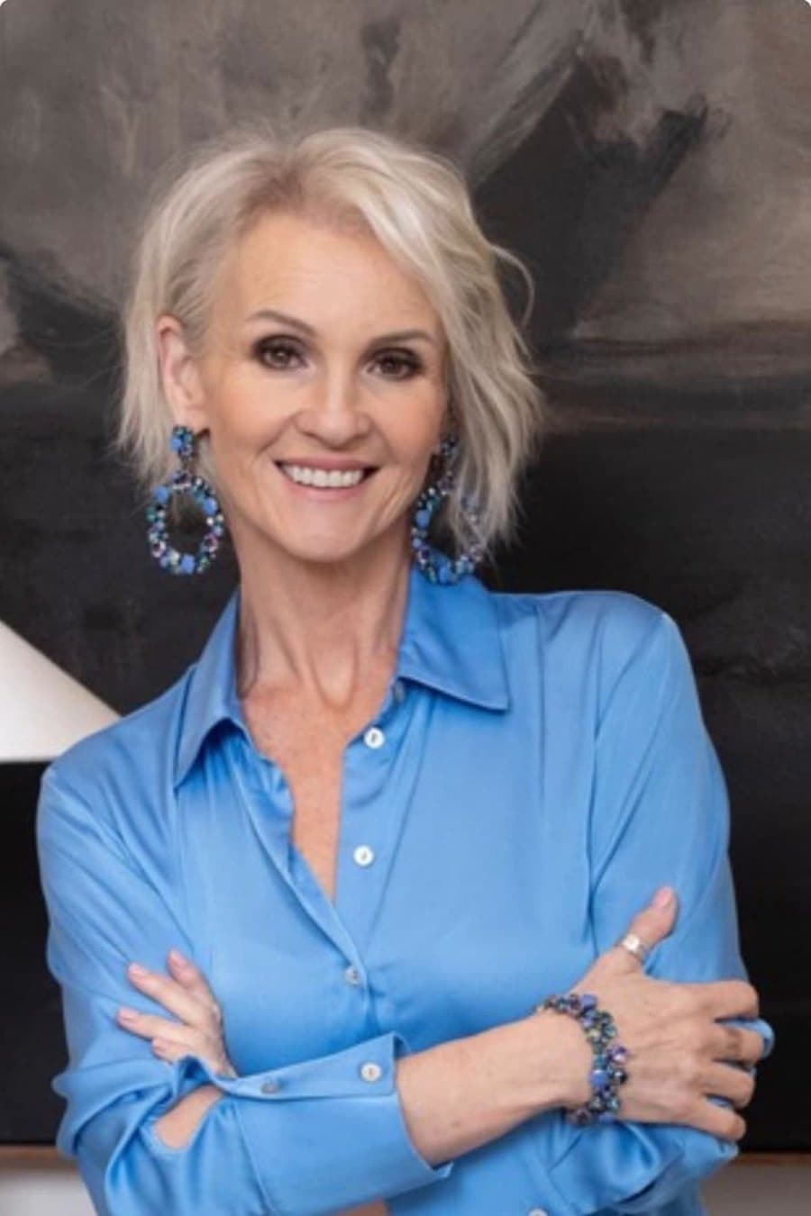 Linda Paige in navy silk — executive coach teaching the 4-Pillar Confidence Framework