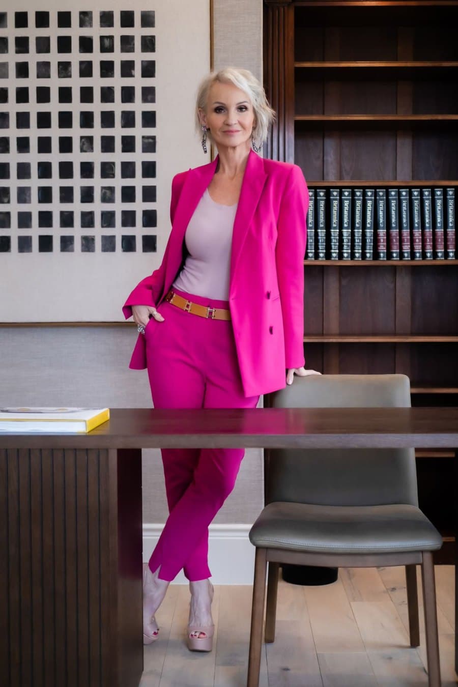 Linda Paige in a pink executive suit — lead coach of the Dress To Connect flagship programme